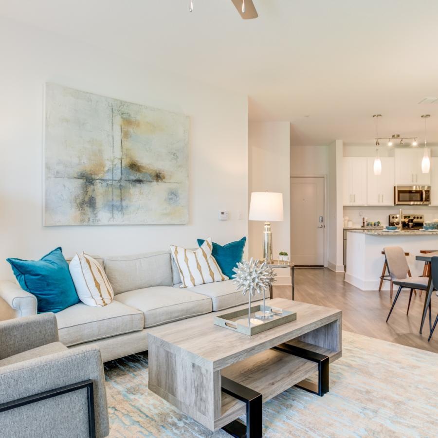 a living room with seating and tables