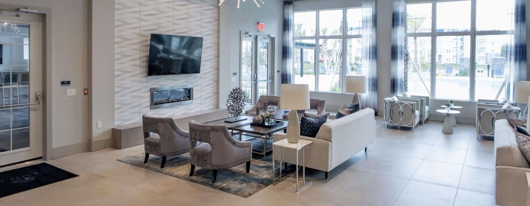 a large living room with a large white wall and a large window