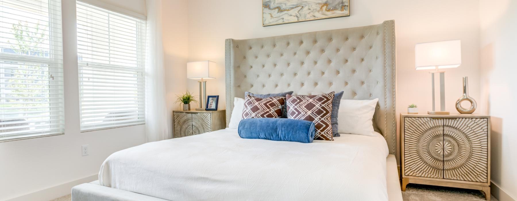 a bed with a white bed spread